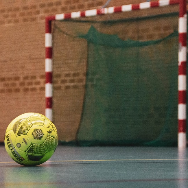 yellow and black soccer ball on field-otuM-nw-_NY-unsplash pascal-swier 650.jpg