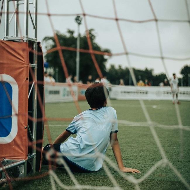 Girl in white shirt sitting on green grassfield HERpo7ZE7t8-unsplash_ chris-yang 650.jpg