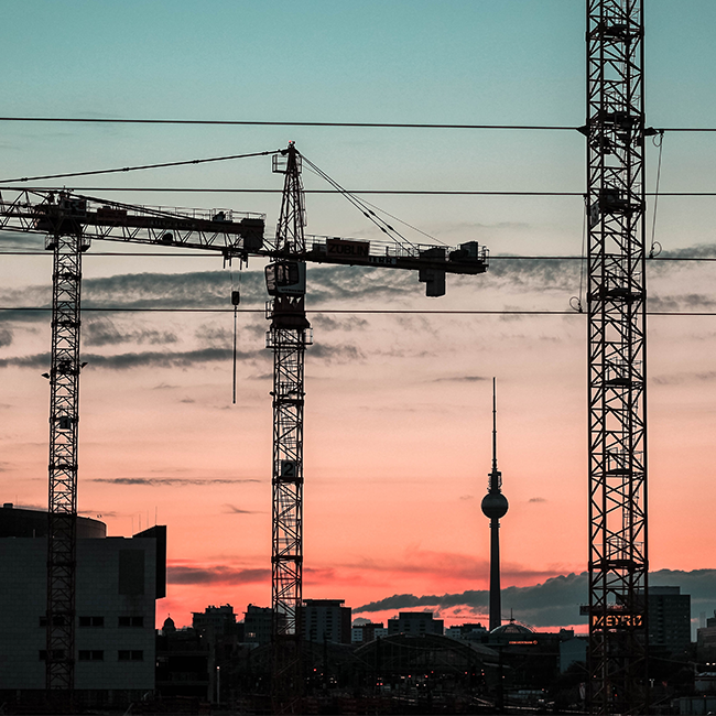 cranes over berlin sky